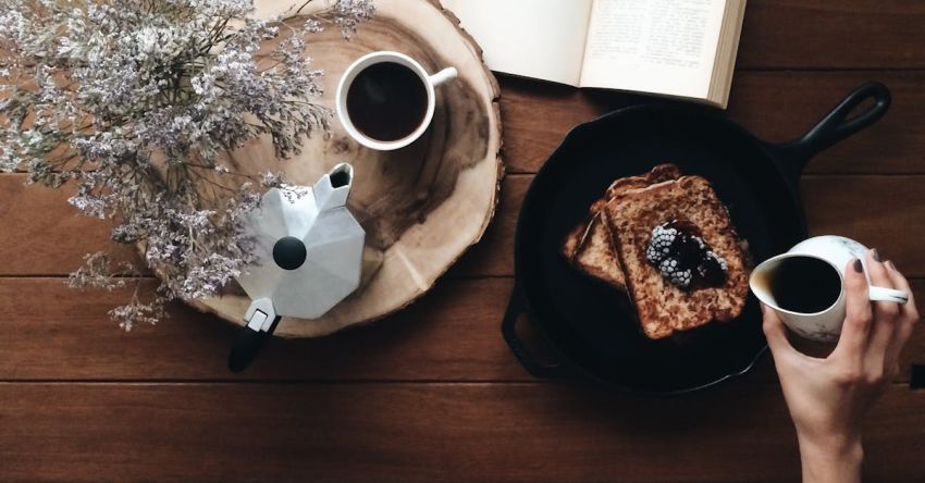 Breaks - Crop woman with dessert and book