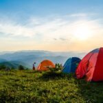 Camping - Photo of Pitched Dome Tents Overlooking Mountain Ranges