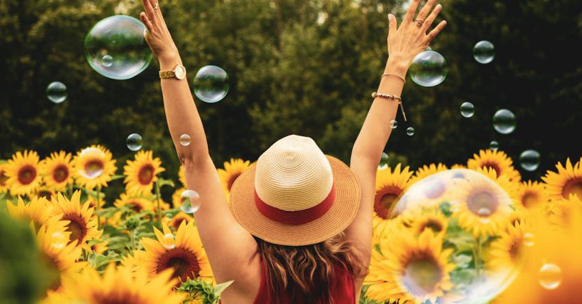 Joy - Woman Surrounded By Sunflowers